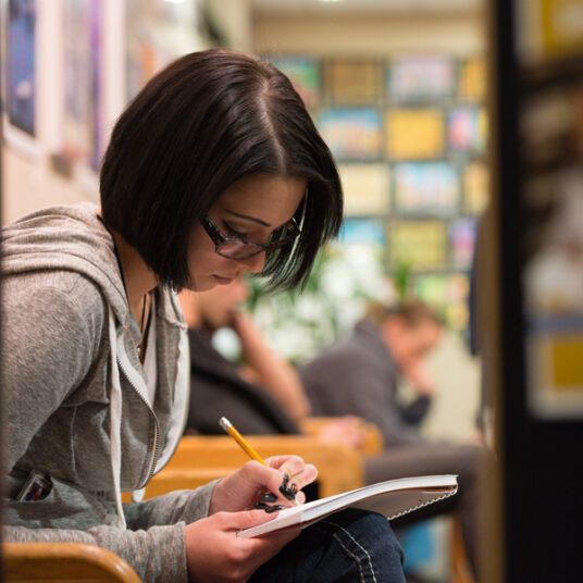 student fills out paperwork