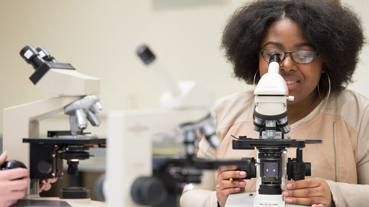 Student at a microscope