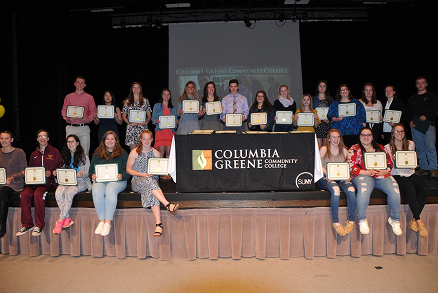 Group of high school students receiving college degrees through the dual enrollment program