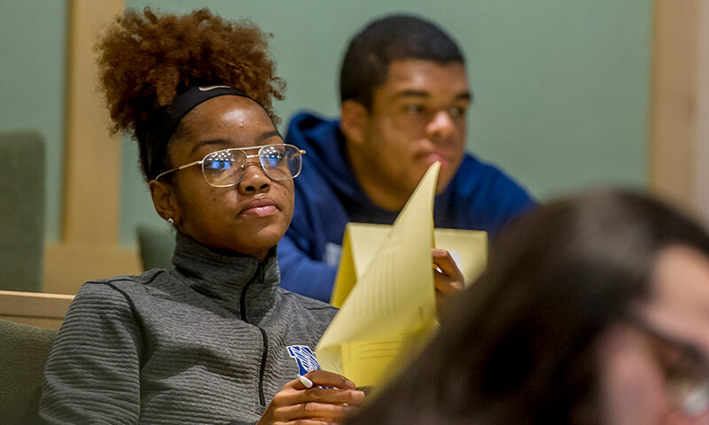 Student in class focused intently