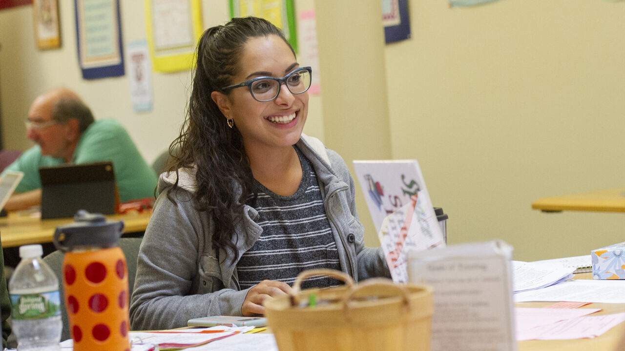 Smiling student at a desk