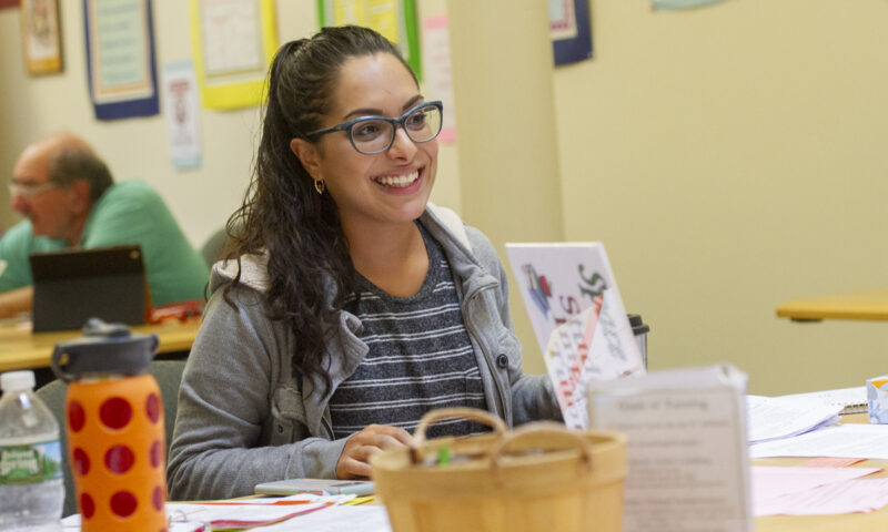 Smiling student at a desk