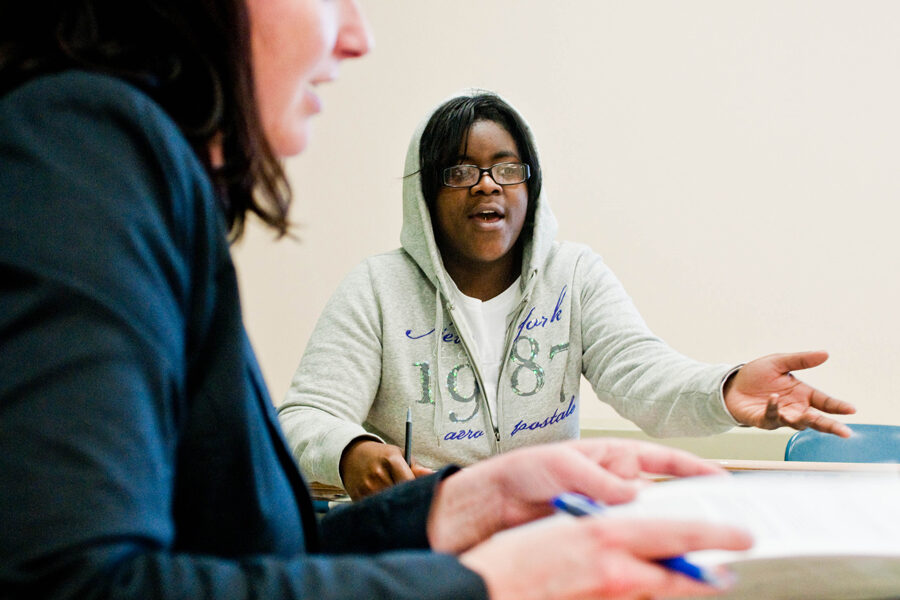 Two students having a conversation in the classroom